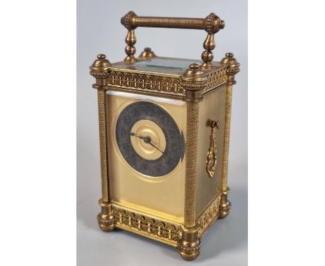 Late Victorian ornate gilt metal carriage clock with French movement. (B.P. 21% + VAT)  No key.  Some wear to gilt metal.  No