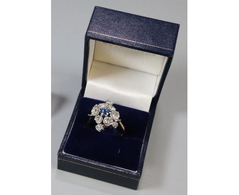 18ct gold sapphire and diamond cluster ring. 10g approx. Size S. (B.P. 21% + VAT)  Carat size 1.2 very approx.  Difficult to 