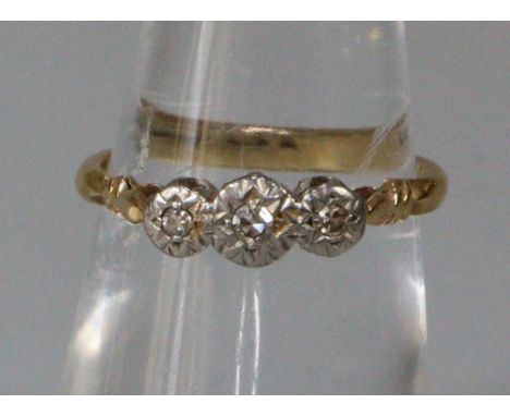 18ct gold diamond three stone ring.  2.4g approx.  Size J.   (B.P. 21% + VAT) 
