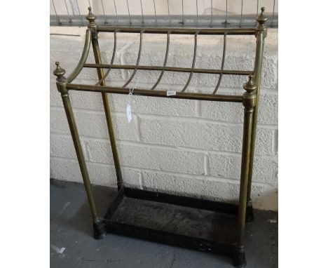 Victorian brass stick stand with cast iron base. (B.P. 21% + VAT)  Structure is loose with splits to brass.  Used condition a