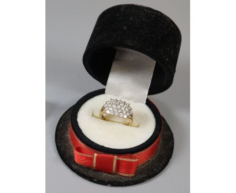 Novelty ring box in the form of a top hat the interior revealing a 9ct gold white stone cluster dress ring.  4.6g approx.  Si