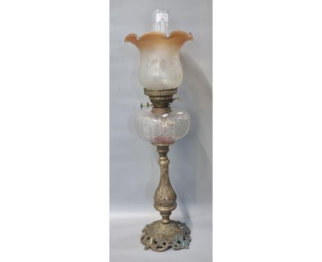 Early 20th century double oil burner lamp having orange and frosted etched glass shade above a moulded glass reservoir standi