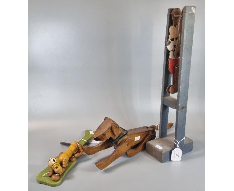 Vintage wooden Micky Mouse acrobat toy on rectangular base together with two other vintage toys: a wooden reticulated dog and