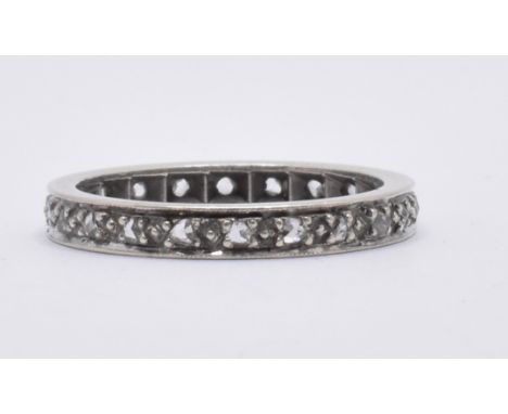 A 9ct gold white stone eternity ring. Band ring set with white stones. Total weight 3.0g / Size N.5