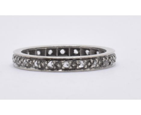 A 9ct gold white stone eternity ring. Band ring set with white stones. Total weight 3.0g / Size N.5