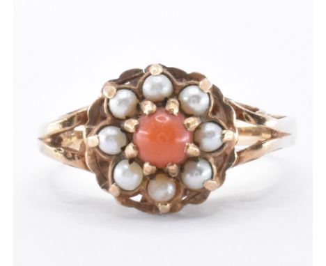 A 9ct gold coral and seed pearl cluster ring. The ring having a round head set with a round coral cabochon surrounded by seed