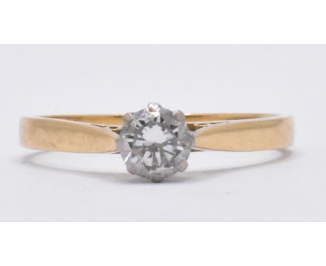 An 18ct gold London hallmarked single stone diamond solitaire ring. The ring with central round brilliant cut stone, estimate