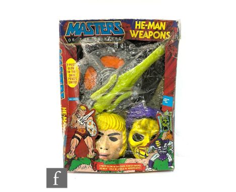 A Thomas Salter Masters of the Universe He-Man Weapon Set, comprising sword, shield, two wrist cuffs and belt in two parts, b
