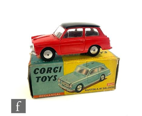 A Corgi 216M Austin A40 Saloon diecast model in red with black roof, silver trim, flat spun hubs and mechanical motor in blue