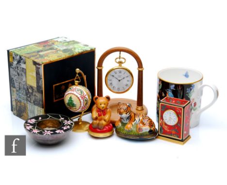 A collection of assorted Halcyon Days Enamels comprising a pocket watch with stand, a beaker, a bone china mug, a Christmas h