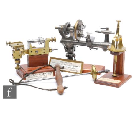 An early 20th Century Lorch watchmaker's lathe, a brass watch case machine, a brass Uplighting tool from the 1885 Henri Picar