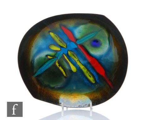 A 1950s enamel dish of abstract form with abstract enamel decoration in red, yellow and blue over copper, signed, width 19cm.