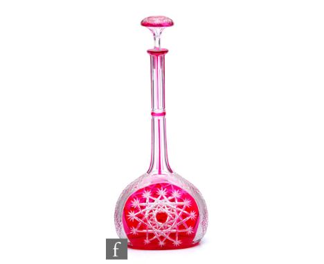 A large early 20th Century Baccarat Tsar glass decanter of compressed globe and shaft form cased in ruby over clear crystal, 