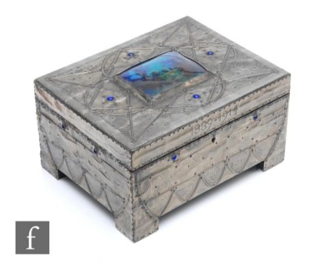 An Arts and Crafts work box with pewter repousse work over a wooden carcass, with central enamel cartouche to lid and blue ca