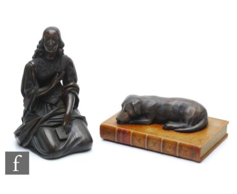 A 19th Century bronze figure of a kneeling maiden with right arm raised and holding a book, height 18cm, and a bronzed desk s