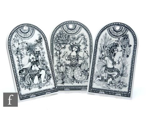 A group of three Nymolle wall plaques designed by Bjorn Wiinblad, of arched form with black figurative decoration over a whit