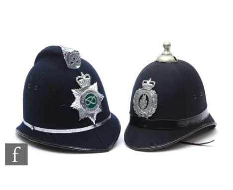 A police blue clock sectional helmet later Stockport Borough police badge, woven liner, height 25cm, and a later Staffordshir