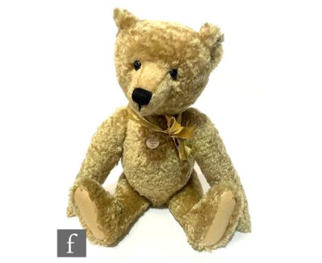 A Steiff 406058 Teddy Bear 1909 Replica, wavy blonde mohair, limited edition 3604 of 5000, with chest tag and certificate, he