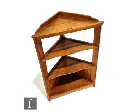 An Alan Grainger 'The Acorn Man' set of floor standing corner shelves, fixed shelves with acorn carved detail to the top shel