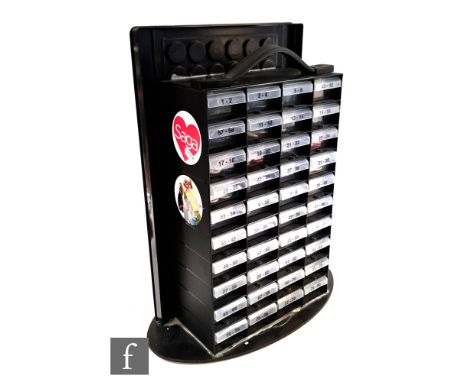 A Pyramid International point of sale button badge display unit, with stock of various badges including Marvel and DC, empty 