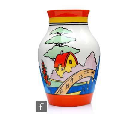 A boxed Wedgwood Clarice Cliff Isis vase decorated in the Orange Roof Cottage pattern, printed mark, height 20.5cm. 