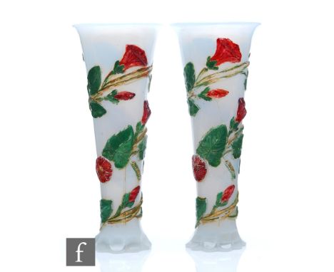 A pair of 19th Century Baccarat opaline vases, petal edged foot rising to a slender flared body with everted rim, relief moul