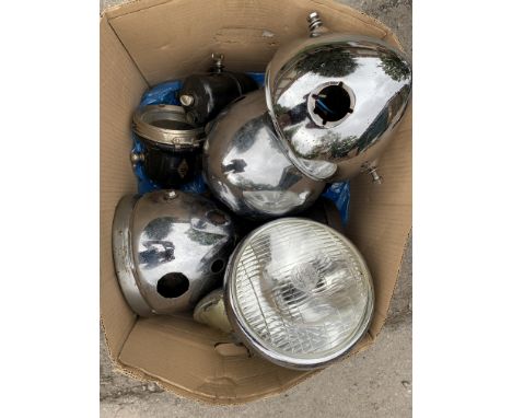 A selection of headlamp shellsincluding Lucas and Wipac together with an acetylene lamp and generator, close inspection advis