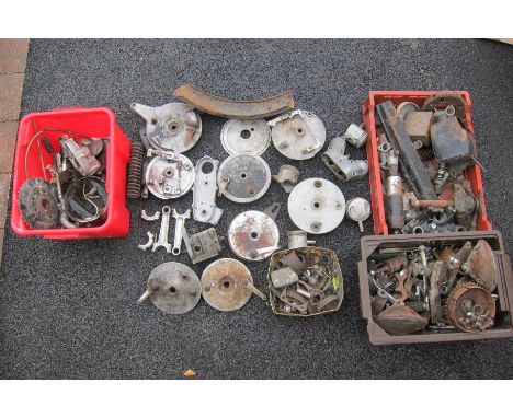 An autojumblers Lotincluding brake plates, fork yokes, chain guards, engine components and sundry other parts, completeness a