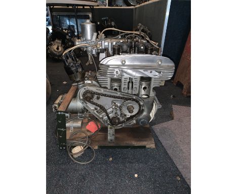 An Ariel Square Four cutaway enginenumbered PL 346, mounted on wooden base, close inspection advised.  Lot to be sold without