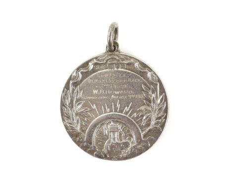 BROOKLANDS - A 1913 B.M.C.R.C. SILVER MEDAL AWARDED TO W G HOWARD FOR THE 1,000CC 10 MILE RECORD RACE,dated 9th August 1913, 