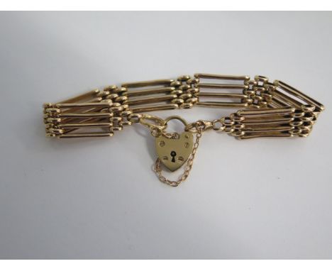 An Edwardian 15ct Rose Gold (marked to the large link) 4 Bar Gate Bracelet with a 9ct Padlock, Total Weight 13.8grms - good c