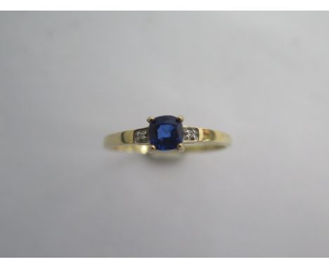 A 9k Tanzanite and diamond yellow gold ring size R/S -approx weight 1.2 grams - almost unworn condition 