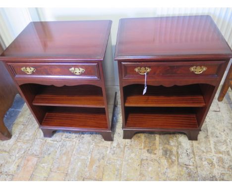 A good quality 20th century pair of mahogany bedside tables both with frieze drawers and adjustable shelf baring label for Ch