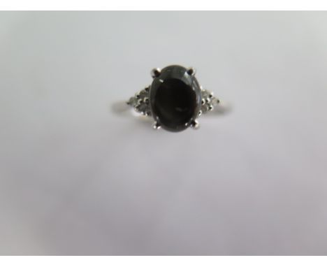 A 9k black star sapphire and diamond white gold ring size R - approx weight 2 grams - almost unworn condition 