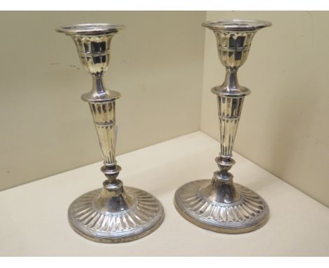 A pair of weighted silver candlesticks - Height 22cm - London 1896/97 William Hutton &amp; Sons Ltd - some rubbing to hallmar