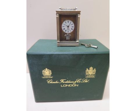 A miniature carriage clock by Charles Frodsham in its original box - Height 19cm - not working 