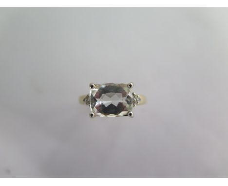 A 9k Goshenite and white sapphire yellow gold ring size R - approx weight 3.5 grams - almost unworn condition 