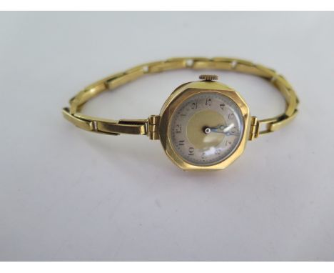 An 18ct yellow gold manual wind ladies wristwatch on 18ct sprung strap - running - approx weight 17.4 grams 