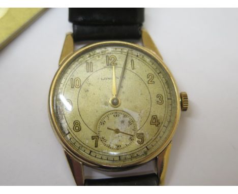 A 9ct yellow gold Longines manual wind presentation  gents wristwatch - 33mm case - hands adjust, running, wear to dial 