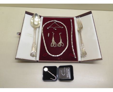 A silver fork and spoon, assorted silver jewellery and a silver napkin diners hook - approx weight 7.5 troy oz - and a white 