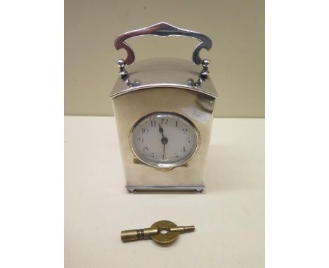 A silver plated Liberty Carriage clock with a blue and white enamel dial - Height 13cm with handle up stamped to base Made by