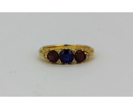 An 18ct yellow gold (stamped 18) ring set with diamonds and other stones, (K).