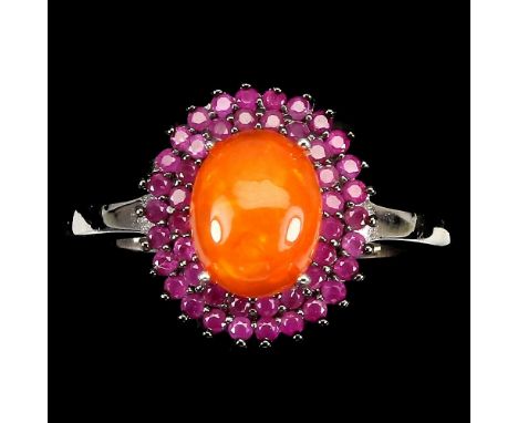 A 925 silver cluster ring set with rubies and a cabochon cut fire opal, (O.5).