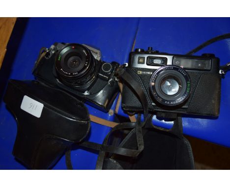 VINTAGE YASHICA ELECTRO 35 CASED CAMERA AND A VINTAGE OLYMPUS OM10 CASED CAMERA