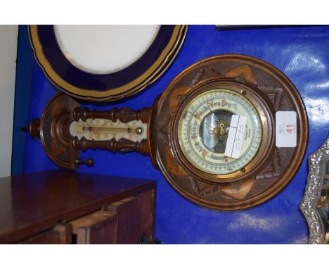 BAROMETER IN CIRCULAR WOODEN FRAME WITH THERMOMETER ABOVE
