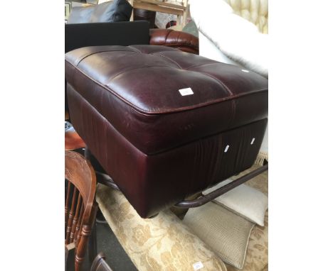 A LEATHER POUFFE