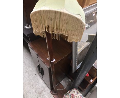 AN OAK STANDARD LAMP