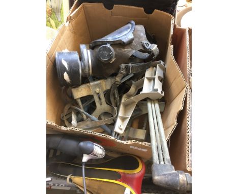 A BOX OF TOOLS AND A GAS MASK