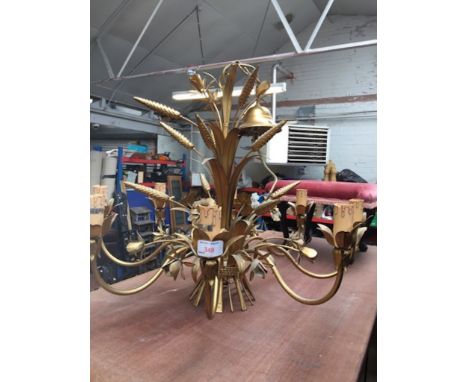 AN ORNATE METAL CEILING LIGHT FITTING