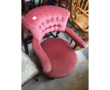 A SALMON COLOURED BUTTON BACK SALON CHAIR